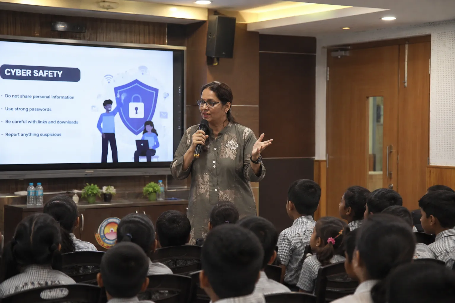 Educator conducting a cyber safety awareness session for school students